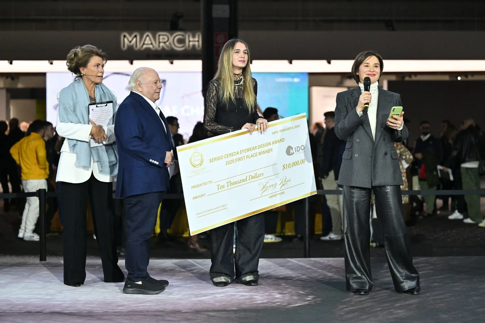 Sergio Cereda Award winner receiving the first-prize cheque at MIDO Milan