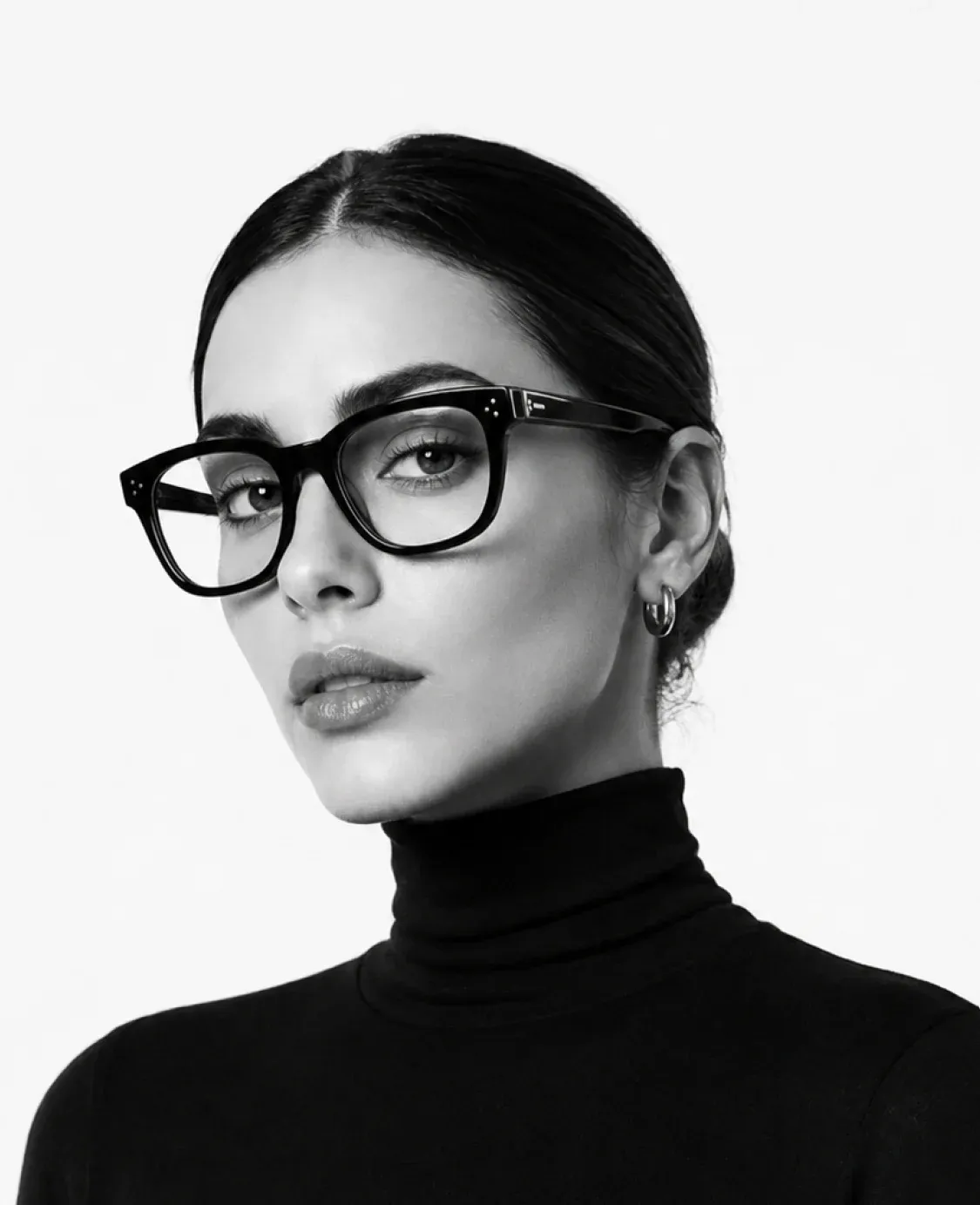 Woman wearing black OPTYX eyeglasses