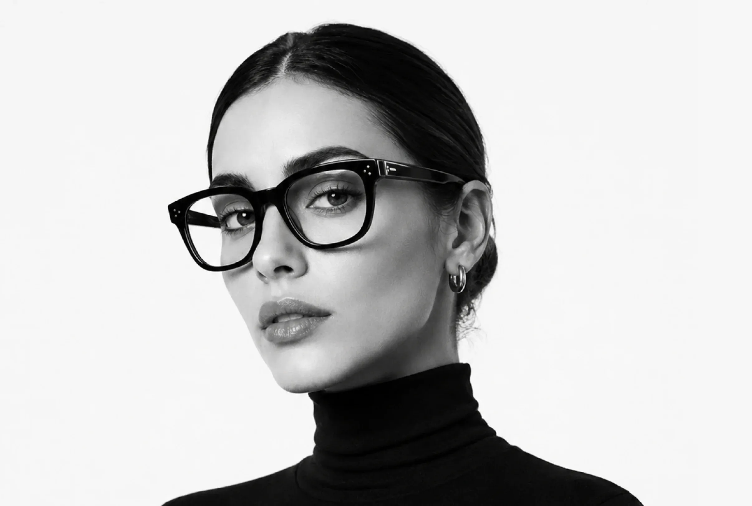 Woman wearing black OPTYX eyeglasses